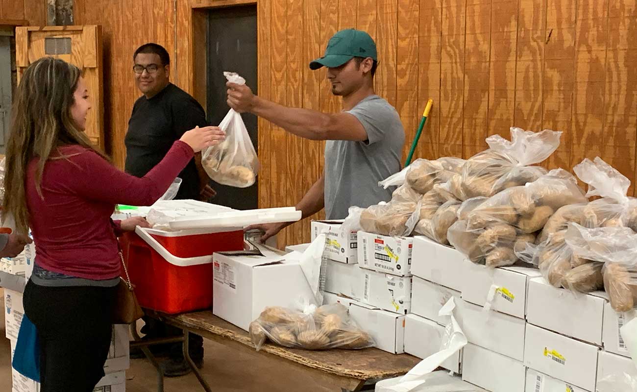 Woman receiving food donation