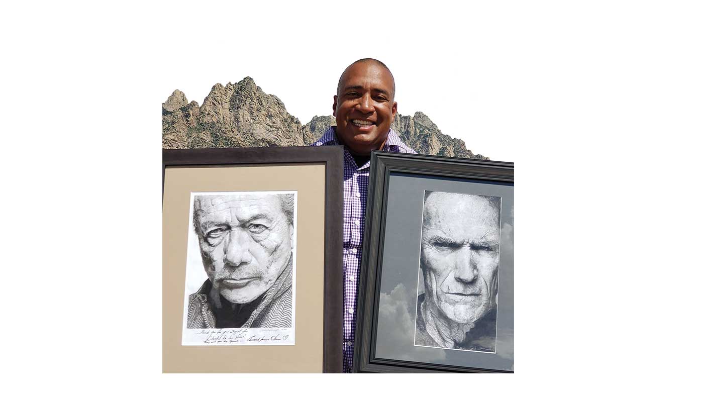 Dusty Richardson with two of his drawings.