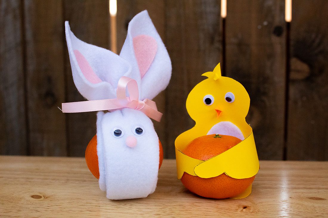 mandarin oranges decorated as a Easter bunny and Easter chick