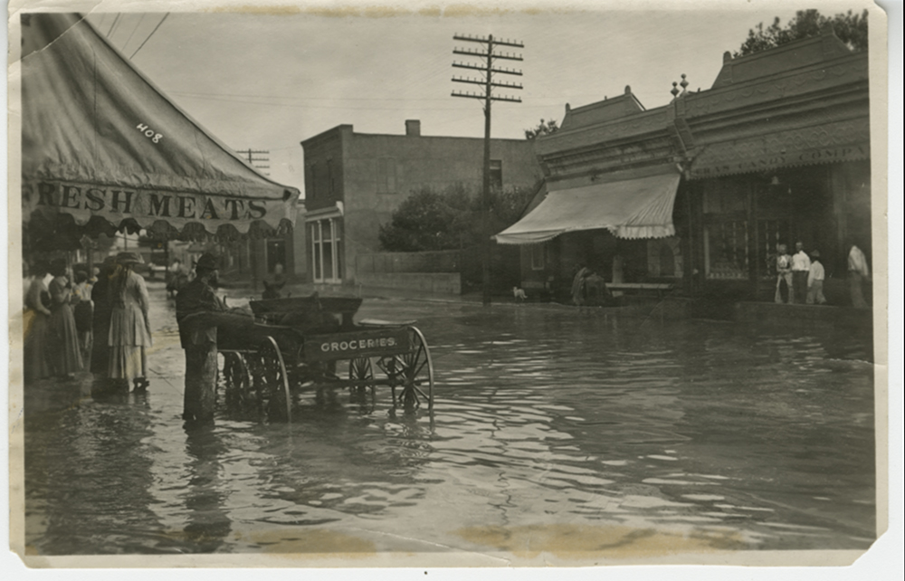 historic photo of Silver City's main street flooded