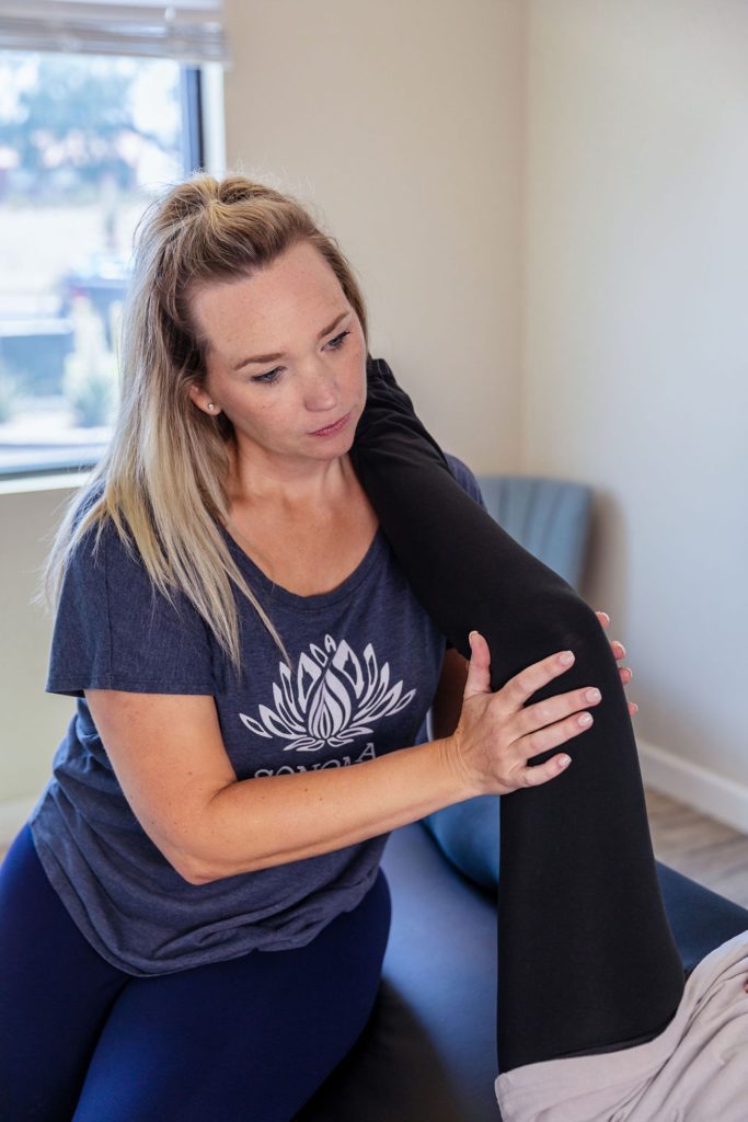 sonoma strech owner preforming a hip release on a client 