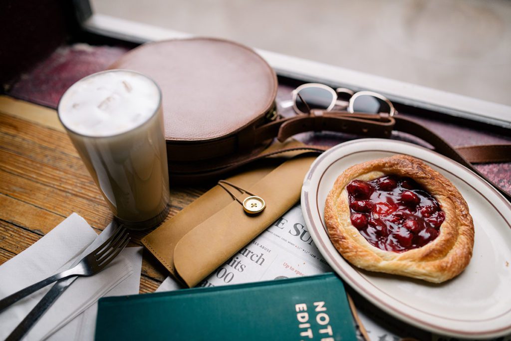 An iced coffee drink and a danish.